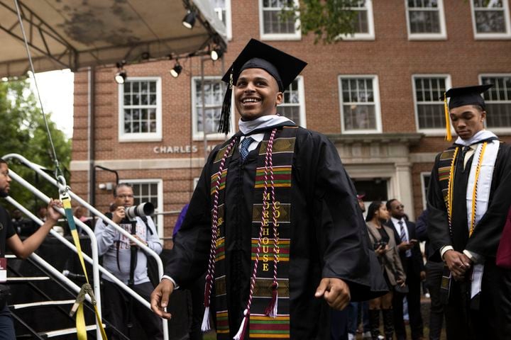A Morehouse College graduate walks to receive his diploma during the Morehouse College commencement ceremony on Sunday, May 21, 2023, on Century Campus in Atlanta. The graduation marked Morehouse College's 139th commencement program. CHRISTINA MATACOTTA FOR THE ATLANTA JOURNAL-CONSTITUTION