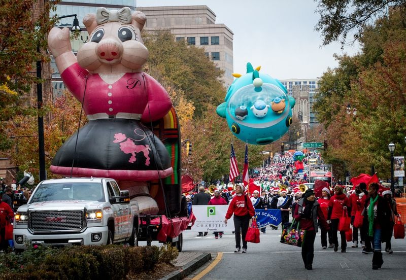 Floats and marching bands make their way up Peachtree Street during the Children's Christmas Parade Saturday, December 03, 2016, in Atlanta. GA. STEVE SCHAEFER / SPECIAL TO THE AJC
