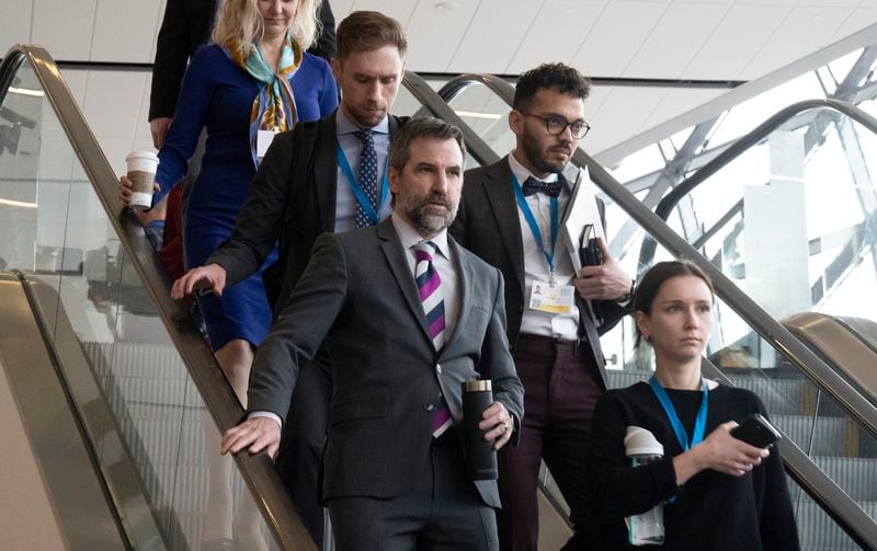FILE - Minister of Environment and Climate Change Steven Guilbeault leaves a news conference at the Intergovernmental Negotiating Committee with staff, April 23, 2024, in Ottawa, Ontario. (Adrian Wyld/The Canadian Press via AP, File)