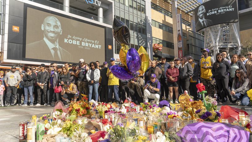 Fans gather  Monday in Los Angeles at a makeshift memorial to Kobe Bryant. (Kyle Grillot/The New York Times)