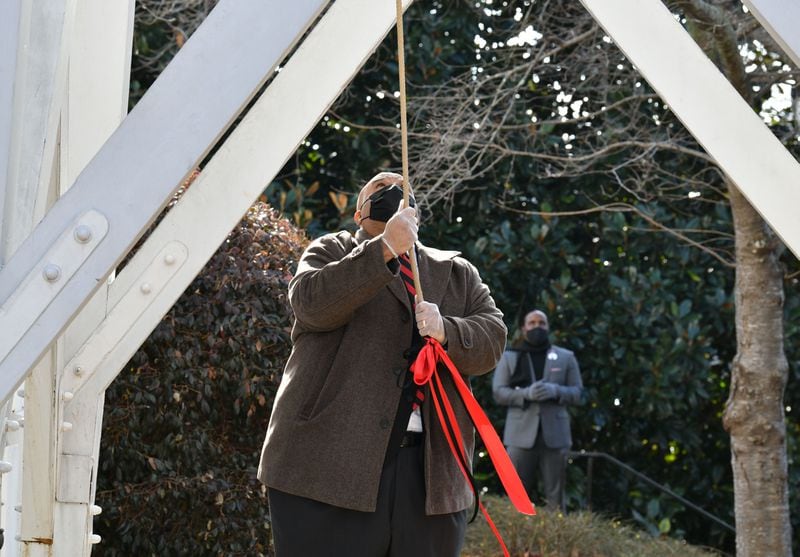 January 9, 20201 Athens - Hamilton Holmes Jr., son of Hamilton Holmes Sr., rings the Chapel Bell to honor the 60th anniversary of desegregation of the University of Georgia outside the UGA Chapel on the campus in Athens on Saturday, January 9, 2021. On January 9, 1961, two courageous students, Hamilton Holmes and Charlayne Hunter, took heroic steps on the University of GeorgiaÕs campus to enroll as students followed by Mary Frances Early, who entered graduate school that summer. Their legacies continue as they have contributed a lifetime of public service to their communities. Because of these students, the university now boasts a diverse campus made of numerous nationalities, races and ethnicities. (Hyosub Shin / Hyosub.Shin@ajc.com)