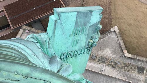 “This is a view of the tablet which the Statue of Liberty is holding,” wrote Walter Kolesky. “It’s taken from her crown after climbing the spiral staircase.”