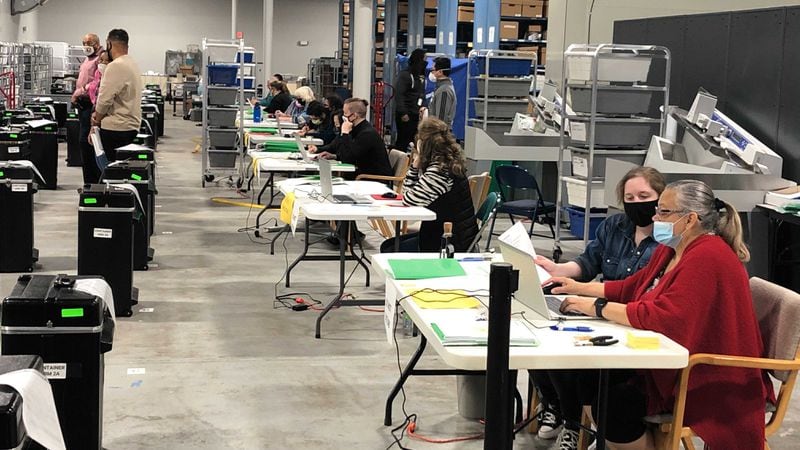 Workers entering recounted votes into Gwinnett County’s database began working in teams of two at each station. (Photo: Christopher Quinn/AJC)