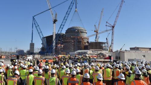 Georgia Power acknowledged more delays in meeting the company's internal interim schedule for completing the nuclear expansion of Plant Vogtle, shown in this 2019 photo during an event. But the company continues to predict it will meet a current regulatory deadline of November, 2021 for commercial operation of the first of two new reactors. The project is already billions of dollars over budget and years behind schedule.  HYOSUB SHIN / HSHIN@AJC.COM