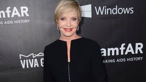 FILE - In this Oct. 29, 2014 file photo, Florence Henderson arrives at the 2014 amfAR Inspiration Gala at Milk Studios in Los Angeles. Henderson, the wholesome actress who went from Broadway star to television icon when she became Carol Brady, the ever-cheerful mom residing over "The Brady Bunch," has died at age 82. She died surrounded by family and friends, her manager, Kayla Pressman, said in a statement late Thursday, Nov. 24, 2016. (Photo by Jordan Strauss/Invision/AP, File)