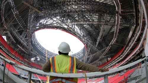 Construction worker Jonathan Goalute watches over the construction progress during a tour of Mercedes-Benz Stadium on Thursday, June 1, 2017, in Atlanta.
