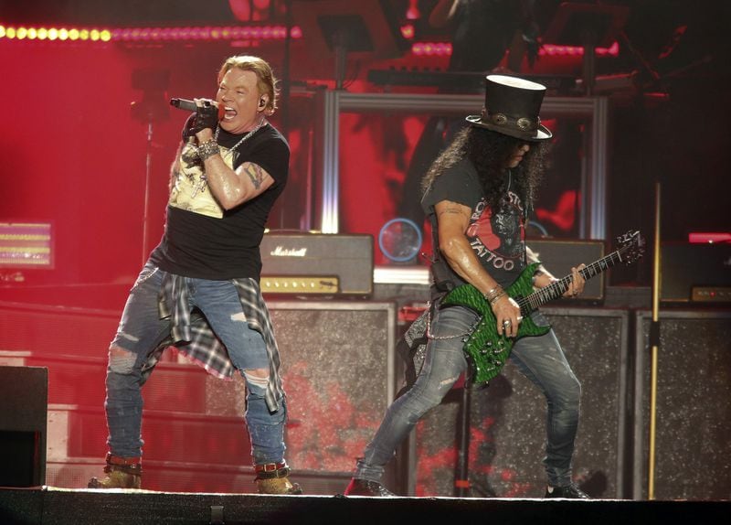 Guns N' Roses' Axl Rose, left, and Slash perform on the first weekend of the Austin City Limits Music Festival at Zilker Park on Friday, Oct. 4, 2019, in Austin, Texas. The band's August 2020 concert in Atlanta has been canceled. (Photo by Jack Plunkett/Invision/AP)