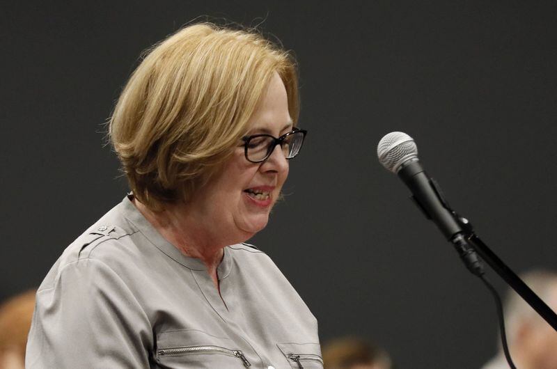 Laura Digges, a Cobb County voter, speaks Wednesday during the public comment period of the Secure, Accessible & Fair Elections (SAFE) Commission’s first meeting in Marietta. Bob Andres / bandres@ajc.com Bob Andres / bandres@ajc.com