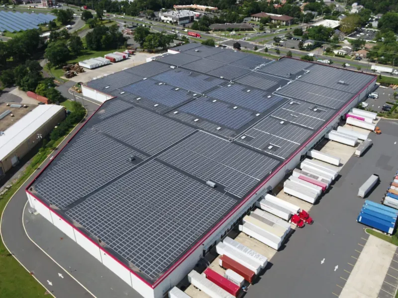 This Edison, NJ, roof shows an example of a behind-the-meter traditional commercial solar project and a community solar project on the same warehouse rooftop. (Credit: Solar Landscape)