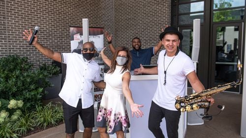 Shelly Danz, a musician and DJ are outside Hotel Avalon in July where they're ready to greet engaged couples driving up for the Atlanta Wedding Extravaganza's curbside event.
