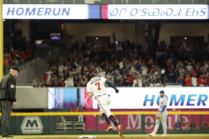 Braves shortstop Dansby Swanson (7) rounds second base after hitting a two-run home run during the fifth inning of a baseball game against the New York Mets at Truist Park on Saturday, Oct. 1, 2022. Miguel Martinez / miguel.martinezjimenez@ajc.com