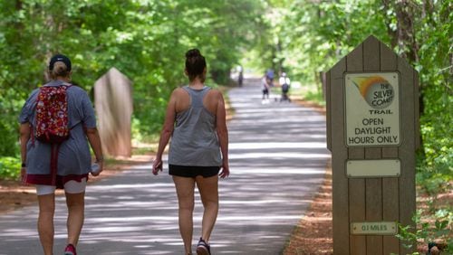 People walk along the Silver Comet Trail in Smyrna on Saturday. STEVE SCHAEFER / SPECIAL TO THE AJC