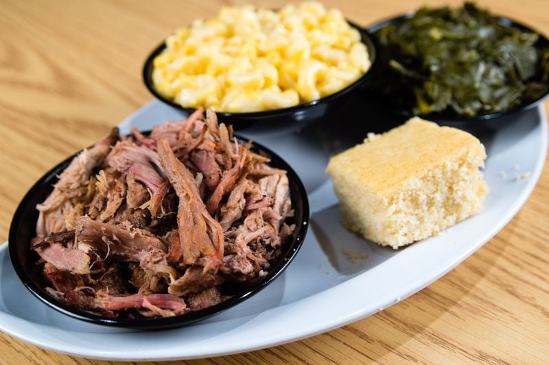 The pulled pork platter at Krazie Barbecue with cornbread, collard greens and macaroni and cheese. If you judge barbecue places by their collard greens, Krazie passes that test. CONTRIBUTED BY HENRI HOLLIS