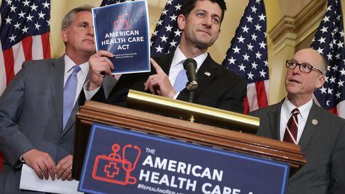 WASHINGTON, DC - MARCH 07: Speaker of the House Paul Ryan (R-WI) (C) holds up a copy of the American Health Care Act during a news conference with House Majority Leader Kevin McCarthy (R-CA) (L) and House Energy and Commerce Committee Chairman Greg Walden (R-OR) outside Ryan’s office in the U.S. Capitol March 7, 2017. (Photo by Chip Somodevilla/Getty Images)