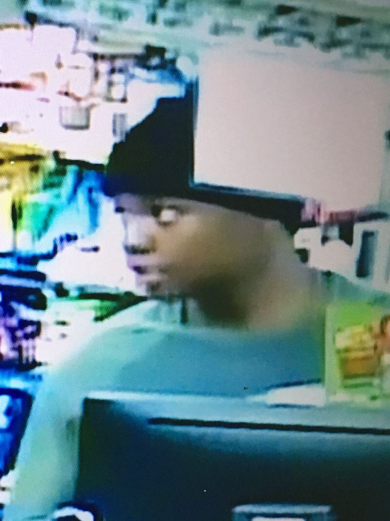 A young man shown in this still from a Coweta County gas station surveillance video is suspected of stealing a VW Beetle with a 3-year-old girl inside. (Photo: Coweta County Sheriff's Office)