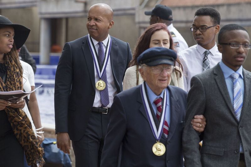 Bryan Stevenson, (left, with medal) and Benjamin Ferencz after the two received the 2018 Martin Luther King, Jr. Peace Prize on Wednesday. ALYSSA POINTER/ALYSSA.POINTER@AJC.COM
