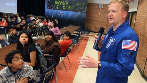 NASA Astronaut and Air Force Col. Eric Boe talks to about 330 sixth grade students about his two-week trip on Discovery that docked with the International Space Station at Sequoyah Middle School Wednesday, May 4, 2011. It was the final mission of Space Shuttle Discovery, launched February 24, 2011, and landing on March 9, 2011. The six-man crew joined the other six-man crew of Expedition 26, who were already aboard the space station. Vino Wong vwong@ajc.com