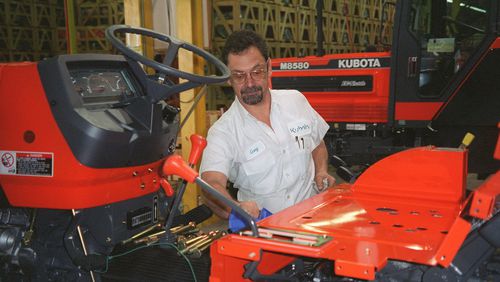 Assembly manager Greg Smith oversees the building a medium-size Kubota tractor. Kubota sent 2.700 employees home Tuesday because of the effects of the coronavirus. (AJC Staff Photo/Peter Kent)