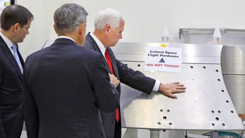Vice President Mike Pence, right, gets a tour of the Orion spacecraft clean room with Sen. Marco Rubio, R-Fla., by Bob Cabana, director of the Kennedy Space Center, center, at the Kennedy Space Center in Cape Canaveral, Fla., on Thursday, July 6, 2017. Pence is leading a newly revived National Space Council. (Red Huber/Orlando Sentinel via AP)