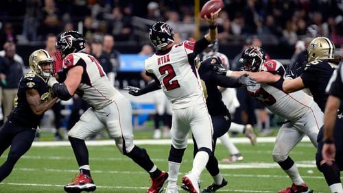Falcons quarterback Matt Ryan (2) passes under pressure in the second half of an NFL football game against the New Orleans Saints in New Orleans, Sunday, Dec. 24, 2017.