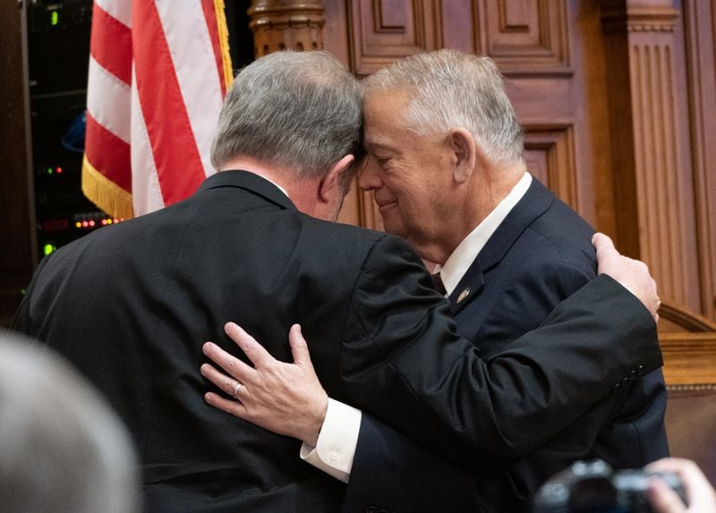 Georgia House Speaker David Ralston, right, hugs House Appropriations Chairman Terry England after he announced Thursday that he won’t seek reelection. Ralston praised England for his work ethic. “I am going to miss him bad,” Ralston said. Ben Gray for the Atlanta Journal-Constitution