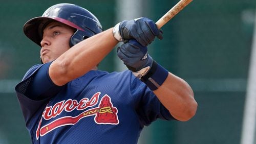 Braves catching prospect Alex Jackson led the Arizona Fall League in home runs before Tuesday. Here he’s pictured hitting a homer at minor league spring training in March. (AP file photo)