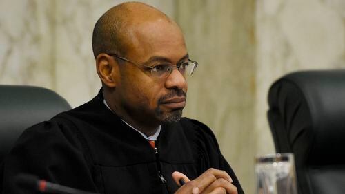 Justice Harold D. Melton listens during oral arguments at The Georgia Supreme Court. (DAVID BARNES / DAVID.BARNES@AJC.COM)