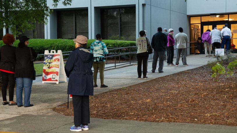 People stand in line to vote at the South Fulton Service Center early on Friday morning, May 22, 20220. STEVE SCHAEFER FOR THE ATLANTA JOURNAL-CONSTITUTION