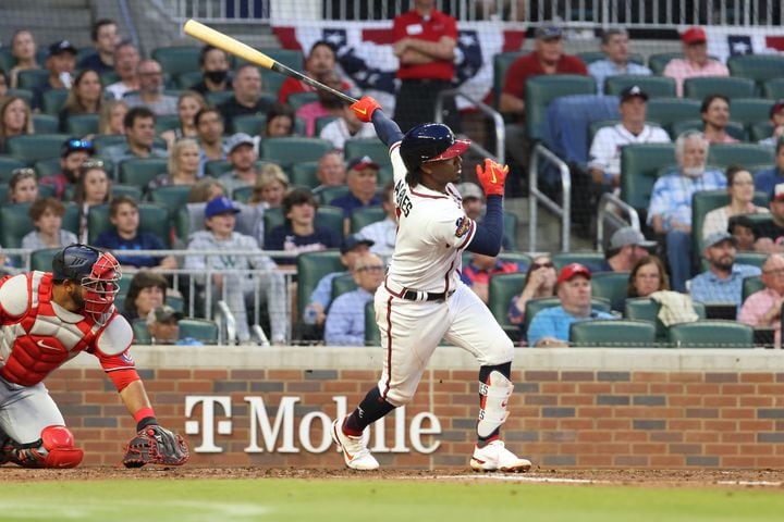 Braves second baseman Ozzie Albies (1) follows through on a two-run double in the second inning at Truist Park on Tuesday, April 12, 2022. Miguel Martinez/miguel.martinezjimenez@ajc.com
