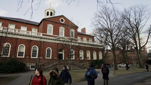 FILE PHOTO: Harvard University students walk through the campus.