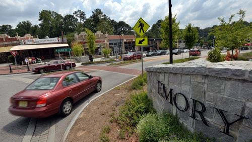 A traffic circle, shops and restaurants near an entrance to Emory University on July 31, 2014. Emory, the Centers for Disease Control and Children’s Healthcare of Atlanta are seeking to be annexed into the city of Atlanta. HYOSUB SHIN / HSHIN@AJC.COM