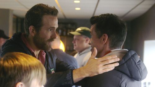 This image released by FX shows Ryan Reynolds, left, and Rob McElhenney in a scene from the third season of "Welcome to Wrexham." (FX via AP)