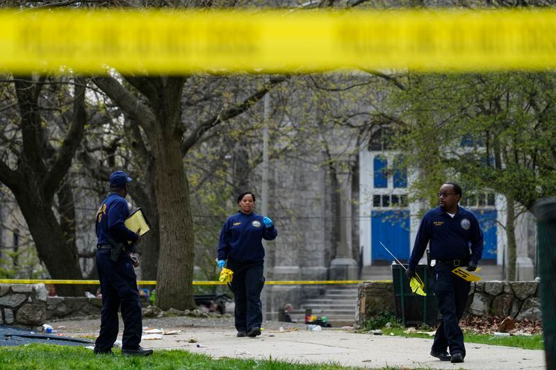 Investigators work the scene of a shooting at an Eid al-Fitr event in Philadelphia, Wednesday, April 10, 2024. (AP Photo/Matt Rourke)