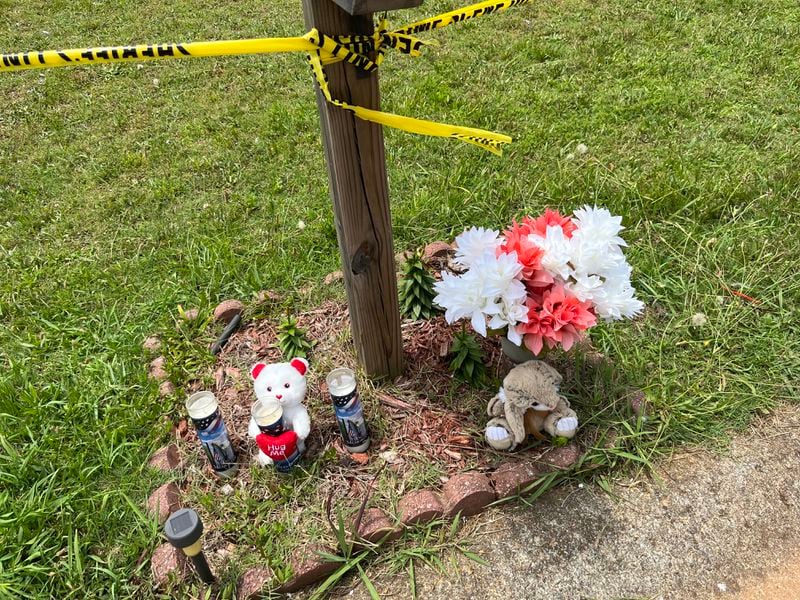 A makeshift memorial was started Saturday, June 25, 2022, after a fatal fire at   a Paulding County home claimed the lives of children. (Photo: Alexis Stevens / AJC)