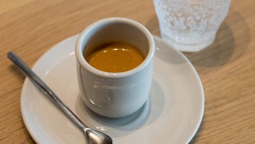 A simple espresso at Revelator in West Midtown, served with sparkling water to cleanse the palate. CONTRIBUTED BY HENRI HOLLIS