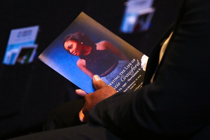 Programs for the funeral service display a photo of Alexis Janae Crawford, a slain 21-year-old senior attending Clark Atlanta University, at Cornerstone Church in Athens, Ga., on Saturday, Nov. 16, 2019. 