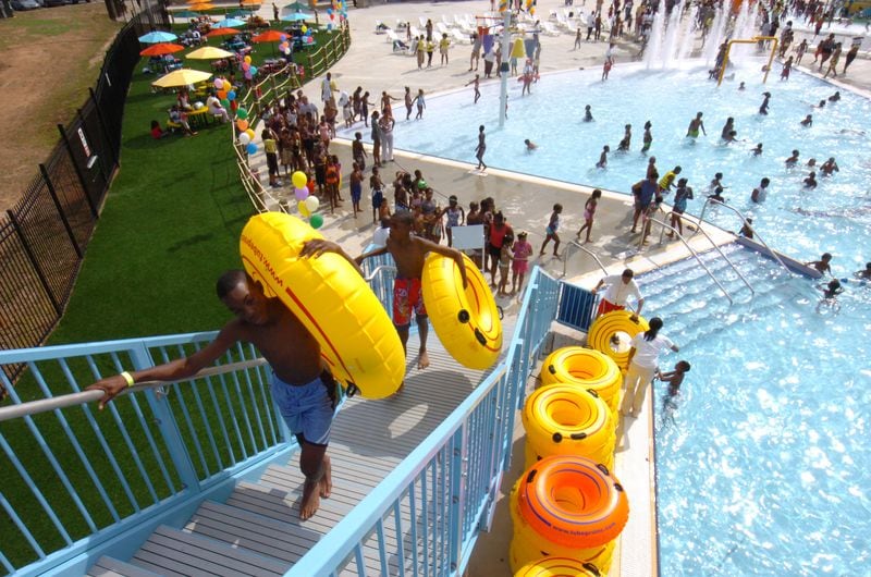 Children play at the Browns Mill Aquatic Center in Stonecrest, which the city plans to take over later this year.