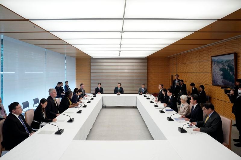 U.S. Ambassador to United Nations Linda Thomas-Greenfield, fourth left, meets with Japan's Chief Cabinet Secretary Yoshimasa Hayashi, center top, and the families of abduction victims by North Korea Thursday, April 18, 2024, at prime minister's office in Tokyo in Tokyo. (AP Photo/Eugene Hoshiko, Pool)