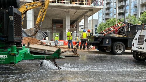 Crews work to repair the water main break at West Peachtree in Midtown Atlanta on Sunday, June 2, 2024. Multiple water main breaks left much of the city without water over the weekend. (David Aaro/AJC)