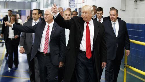 President-elect Donald Trump and Vice President-elect Mike Pence wave as they visit to Carrier factory, in Indianapolis, Ind. Trump is slamming a union leader who criticized his deal to discourage air conditioner manufacturer Carrier Corp. from closing an Indiana factory and moving its jobs to Mexico. Trump tweeted Wednesday evening, Dec. 7, 2016: "Chuck Jones, who is President of United Steelworkers 1999, has done a terrible job representing workers." (AP Photo/Evan Vucci, File)