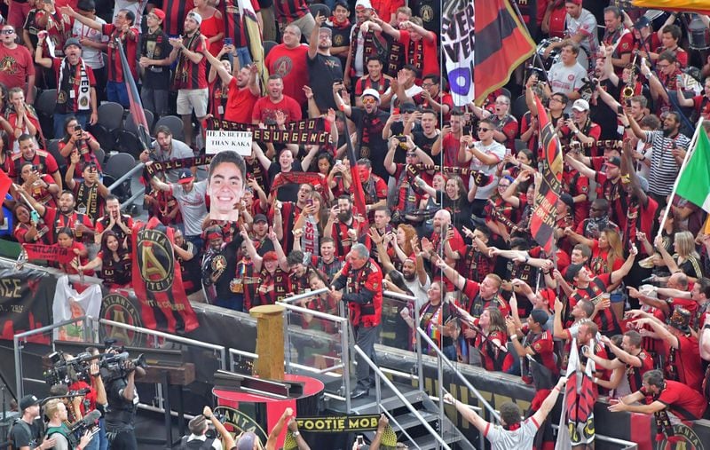 Arthur Blank, owner of Atlanta United FC, hammers in Atlanta United’s golden spike in front of a record-breaking crowd before a match on Saturday, September 16, 2017. HYOSUB SHIN / HSHIN@AJC.COM