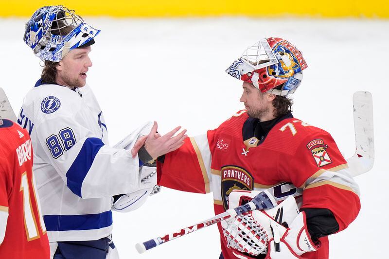 Tampa Bay Lightning goaltender Andrei Vasilevskiy (88) and Florida Panthers goaltender Sergei Bobrovsky (72) congratulate each other after the Panthers beat the Lightning 6-1 during Game 5 of the first-round of an NHL Stanley Cup Playoff series, Monday, April 29, 2024, in Sunrise, Fla. (AP Photo/Wilfredo Lee)