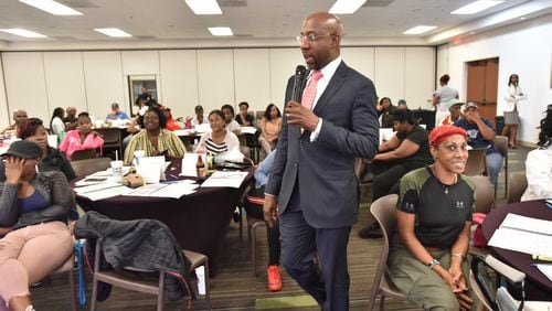 July 18, 2019 Atlanta - Rev. Raphael Warnock speaks to program participants during Good Neighbor Program at the Historic Ebenezer Baptist Church on Thursday, July 18, 2019. The Rev. Raphael G. Warnock has had busy couple of weeks. After co-hosting a conference on ending mass incarceration in the United States, he was off to Baltimore. And less than 24 hours ago, he was back at Ebenezer for the 45th annual scholarship concert honoring the memory of the late Christine Williams King, affectionately known as Mama King, who was assassinated there 45 years ago. (Hyosub Shin / Hyosub.Shin@ajc.com)