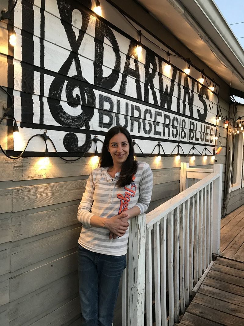Co-owner Lindsay Wine stands in front of Darwin’s Burgers and Blues in Sandy Springs. Darwin’s is becoming popular among locals with events like gospel-themed lunch, painting classes and live bands. CONTRIBUTED BY DARWIN’S BURGERS AND BLUES