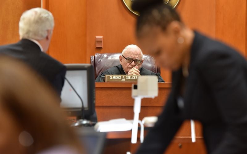 Feb. 18, 2016 Decatur, GA: DeKalb County Superior Court Judge Clarence Seeliger listens to an objection from defense attorney William Mckenna, left. Prosecutor Buffy Williams is pictured on the right. (UPDATE: On Friday, Feb. 26, Robinson was found guilty on six counts but avoided conviction on the most serious charges.)  BRANT SANDERLIN/BSANDERLIN@AJC.COM