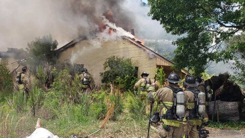 The abandoned church building  on Parkdale Drive was fully engulfed in smoke and flames when crews arrived Monday afternoon, according to DeKalb County fire officials.