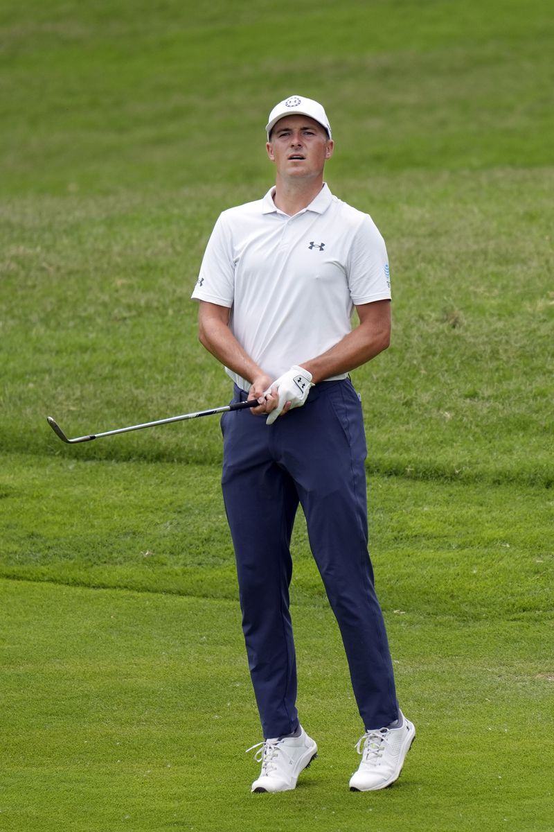Jordan Spieth stretches to see where his shot from the rough landed on the sixth green during the second round of the Byron Nelson golf tournament in McKinney, Texas, Friday, May 3, 2024. (AP Photo/LM Otero)