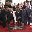 Sen Dog, from left, DJ Muggs, Eric "Bobo" Correa and B-Real, of hip-hop group Cypress Hill, atop their new Hollywood Walk of Fame star on April 18, 2019. CHRIS PIZZELLO/INVISION/AP