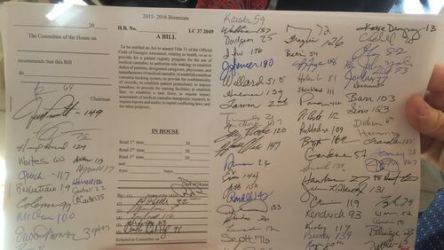 State Rep. Allen Peake shows off the first of 90 signatures on his medical marijuana bill.