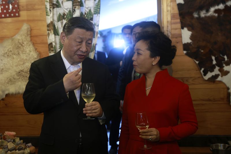 Chinese President Xi Jinping and his wife Peng Liyuan enjoy a drink in a restaurant, Tuesday, May 7, 2024 at the Tourmalet pass, in the Pyrenees mountains. French president is hosting China's leader at a remote mountain pass in the Pyrenees for private meetings, after a high-stakes state visit in Paris dominated by trade disputes and Russia's war in Ukraine. French President Emmanuel Macron made a point of inviting Chinese President Xi Jinping to the Tourmalet Pass near the Spanish border, where Macron spent time as a child visiting his grandmother. (AP Photo/Aurelien Morissard, Pool)